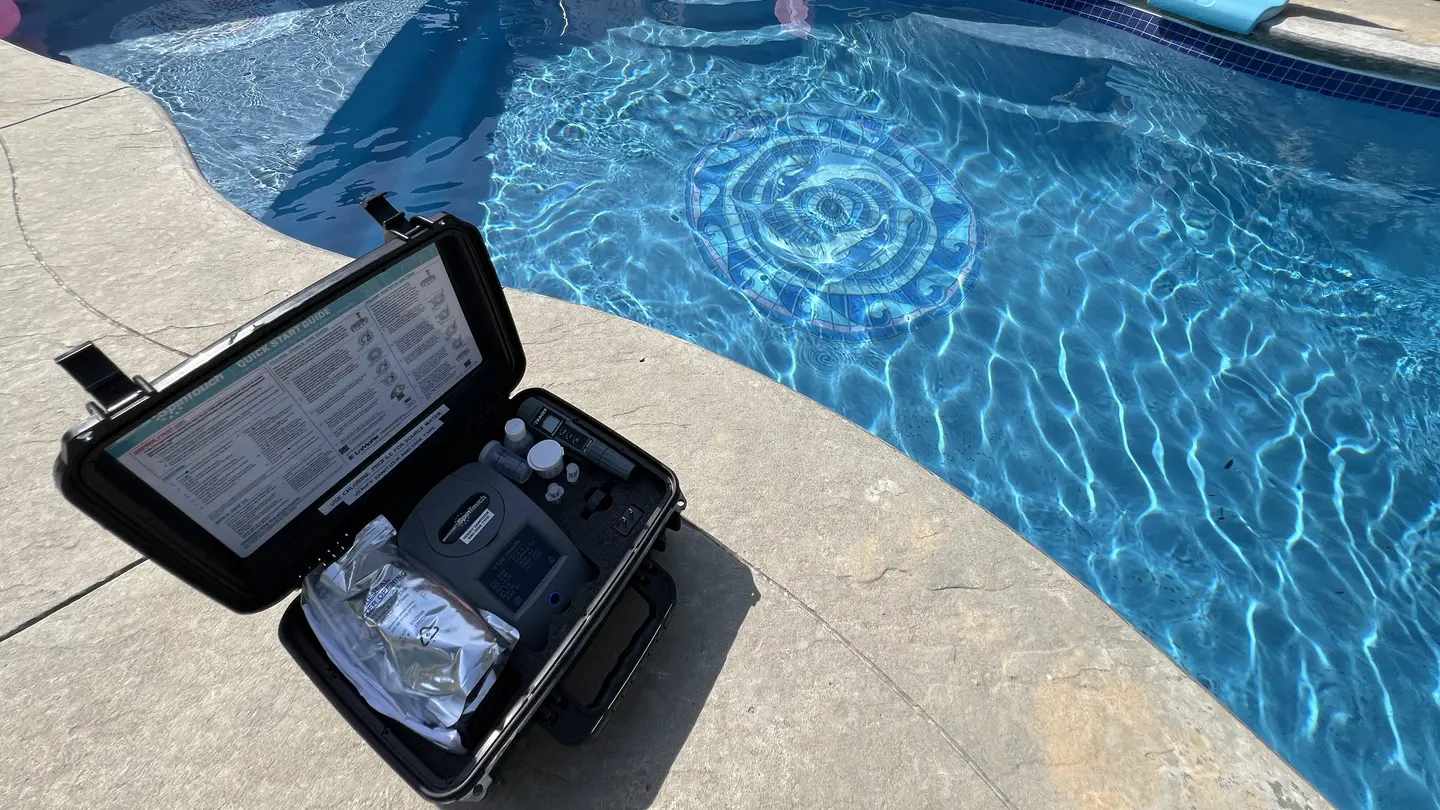 Pool technician servicing a residential pool in Oak Island, NC