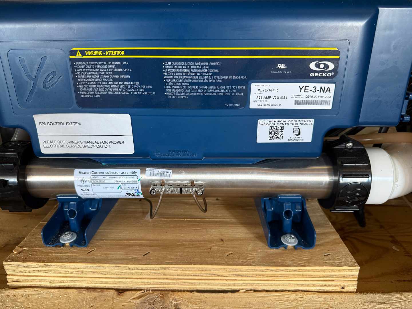 Pool and spa heater unit with visible PVC plumbing connections at a coastal property in Oak Island, NC